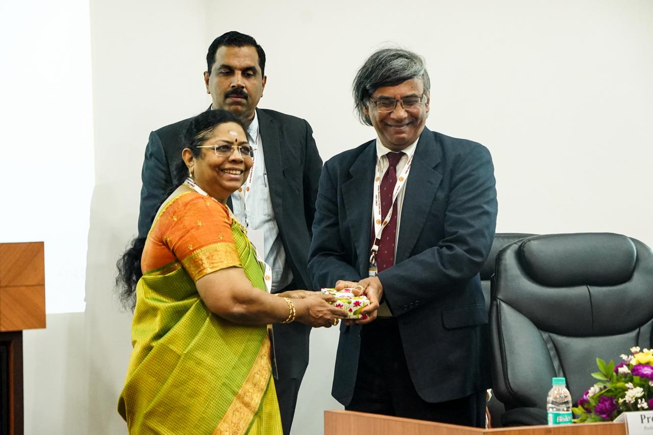Prof. M. Thenmozhi presents a memento to the Chief Guest, Prof. Avanidhar Subrahmanyam.